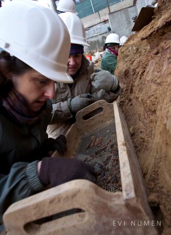 Archaeologists Kimberlee Moran and Anna Dhody Examine Artifacts